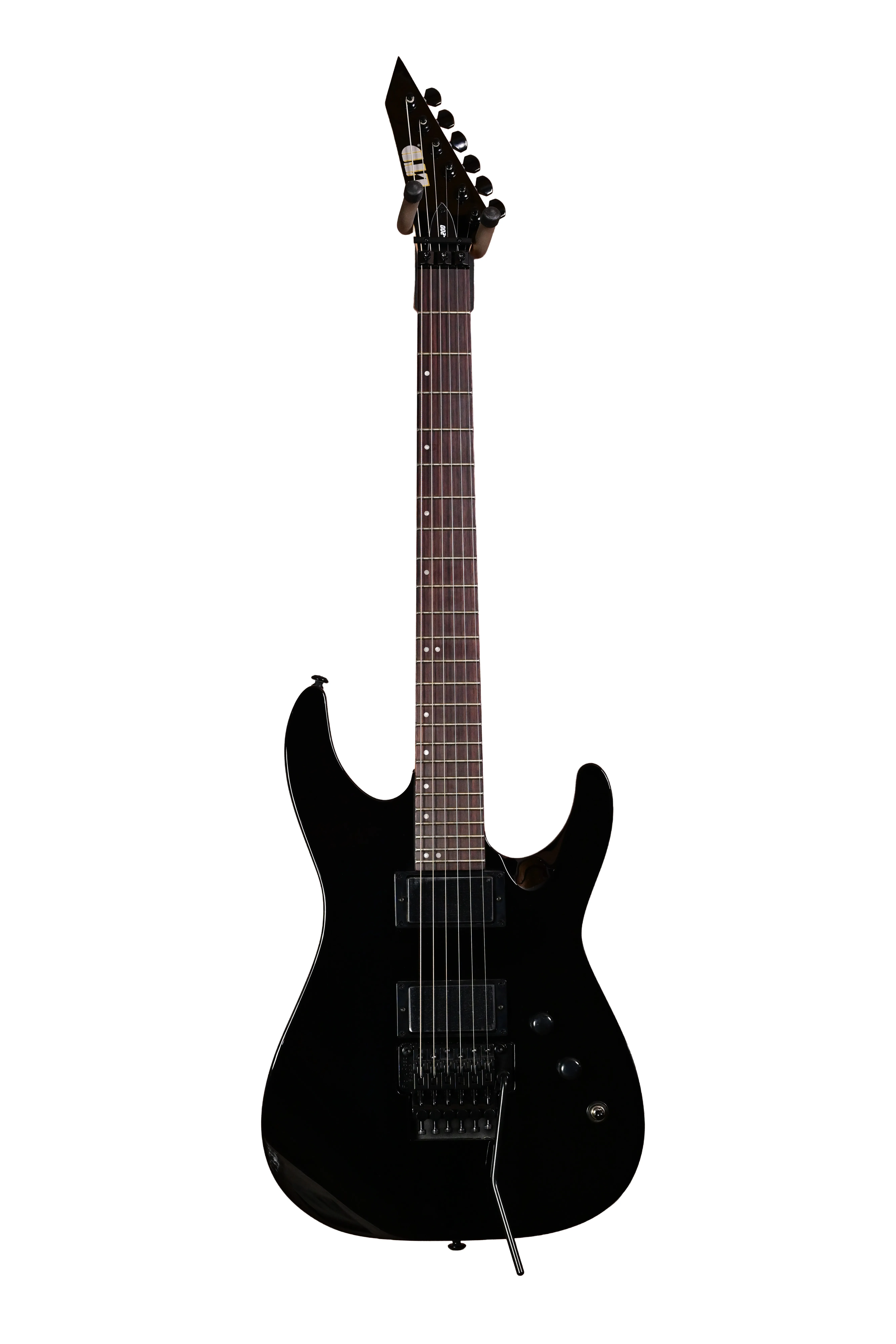 E-Gitarre, schwarzer Korpus, Doppelspulen-Tonabnehmer, Tremolo-System, spitze Kopfplatte